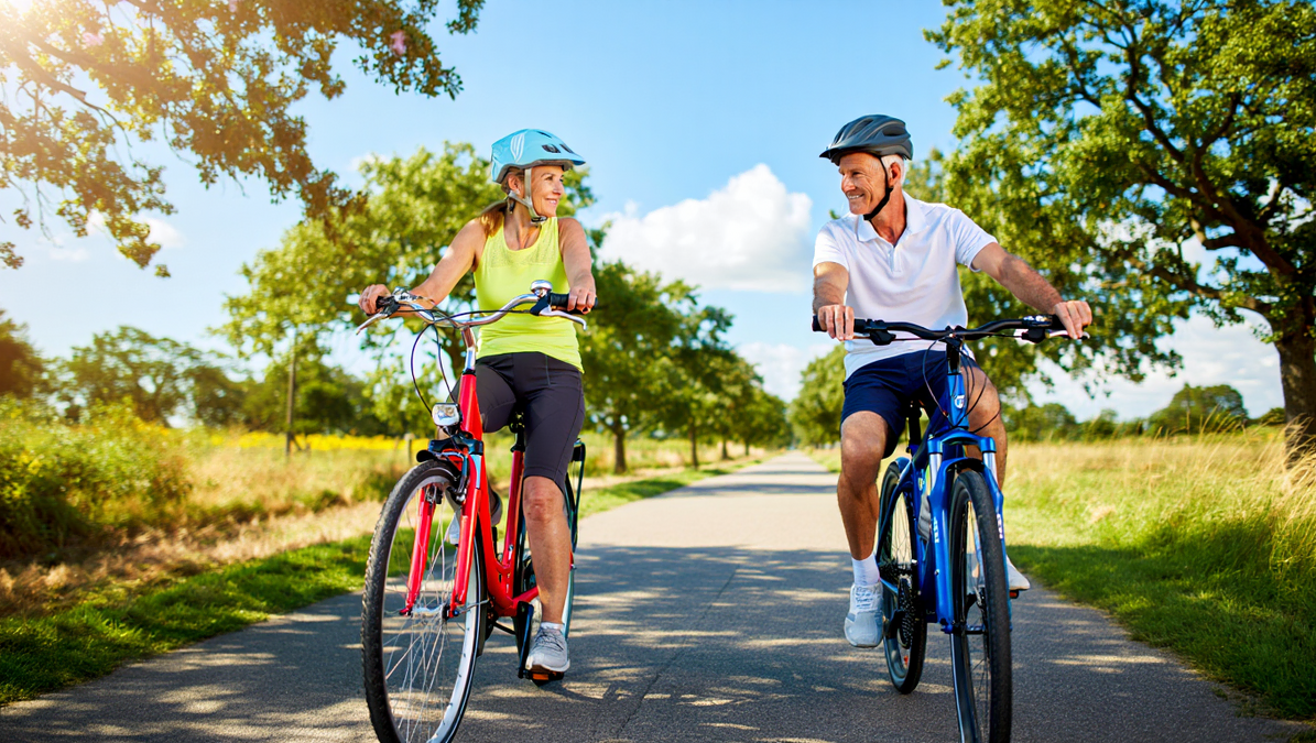 Active Senior Couple Cycling Together